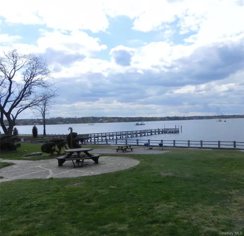 a view of a lake with a car parked