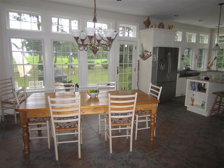 86 Howes Path Dennis, MA 02638 - Photo 12 of 30 a dining room with furniture a chandelier and window