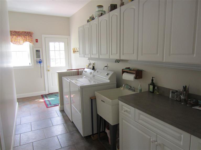 86 Howes Path Dennis, MA 02638 - Photo 15 of 30 a utility room with a sink a washer and dryer