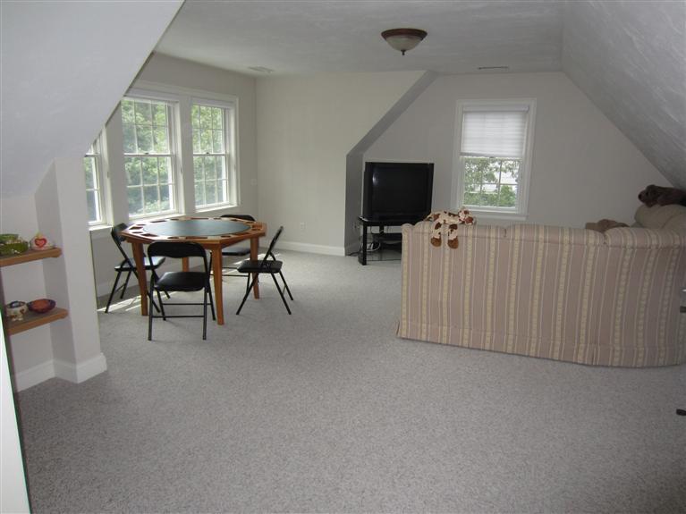 86 Howes Path Dennis, MA 02638 - Photo 25 of 30 a living room with furniture a flat screen tv and a large window