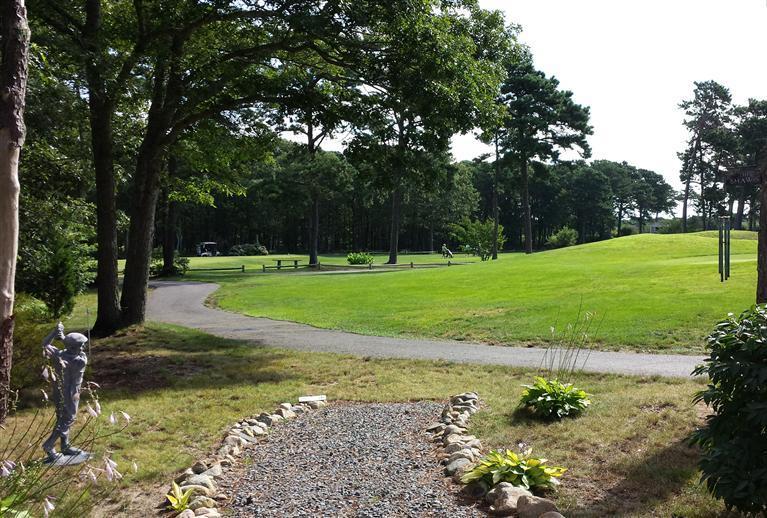 86 Howes Path Dennis, MA 02638 - Photo 28 of 30 a view of a golf course with a lake