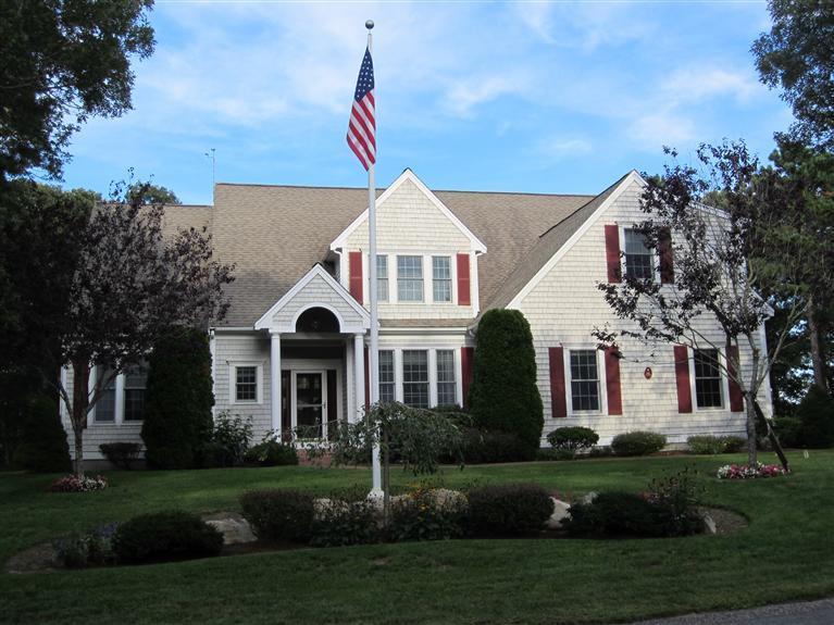 86 Howes Path Dennis, MA 02638 - Photo 29 of 30 a front view of a house with a yard