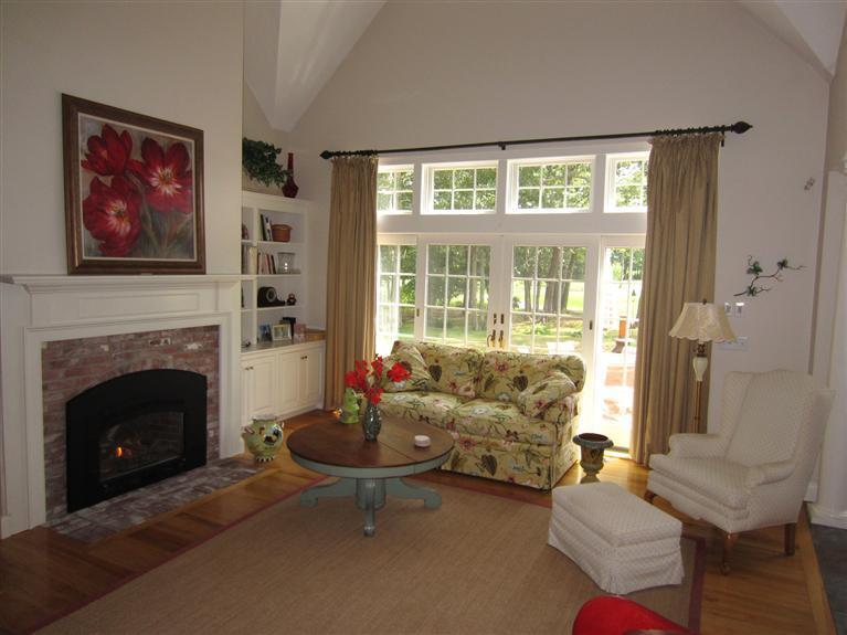 86 Howes Path Dennis, MA 02638 - Photo 8 of 30 a living room with furniture and a fireplace
