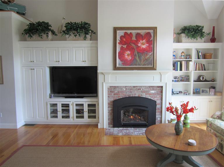 86 Howes Path Dennis, MA 02638 - Photo 9 of 30 a living room with furniture and a fireplace