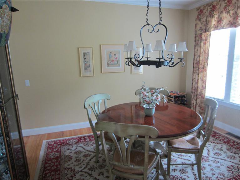 86 Howes Path Dennis, MA 02638 - Photo 10 of 30 a view of a dining room with furniture and chandelier