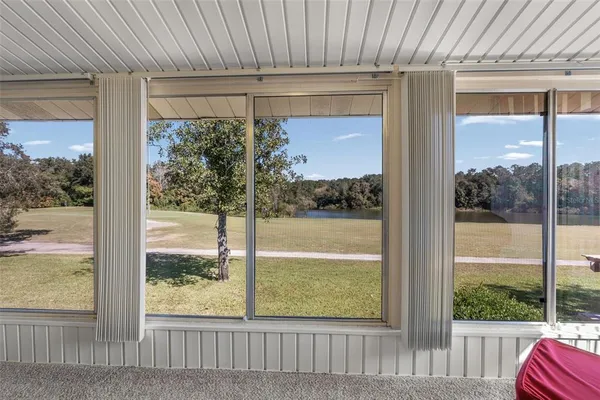 a view of a livingroom with furniture and a flat screen tv