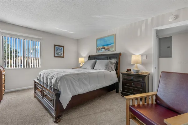 a view of tennis court with houses