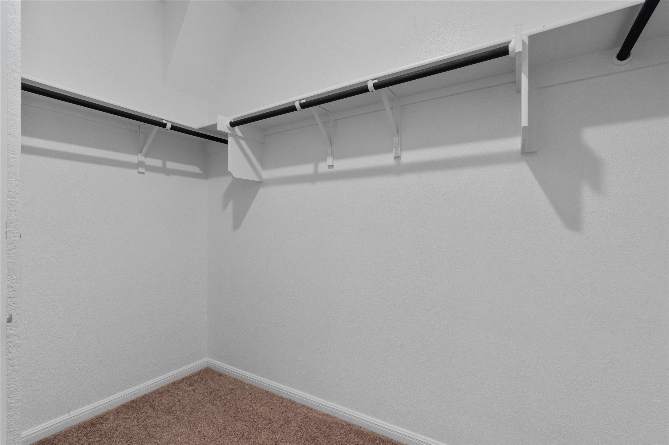 10613 Ridan Way Buda, TX 78610 - Photo 18 of 32 a view of an empty walk in closet