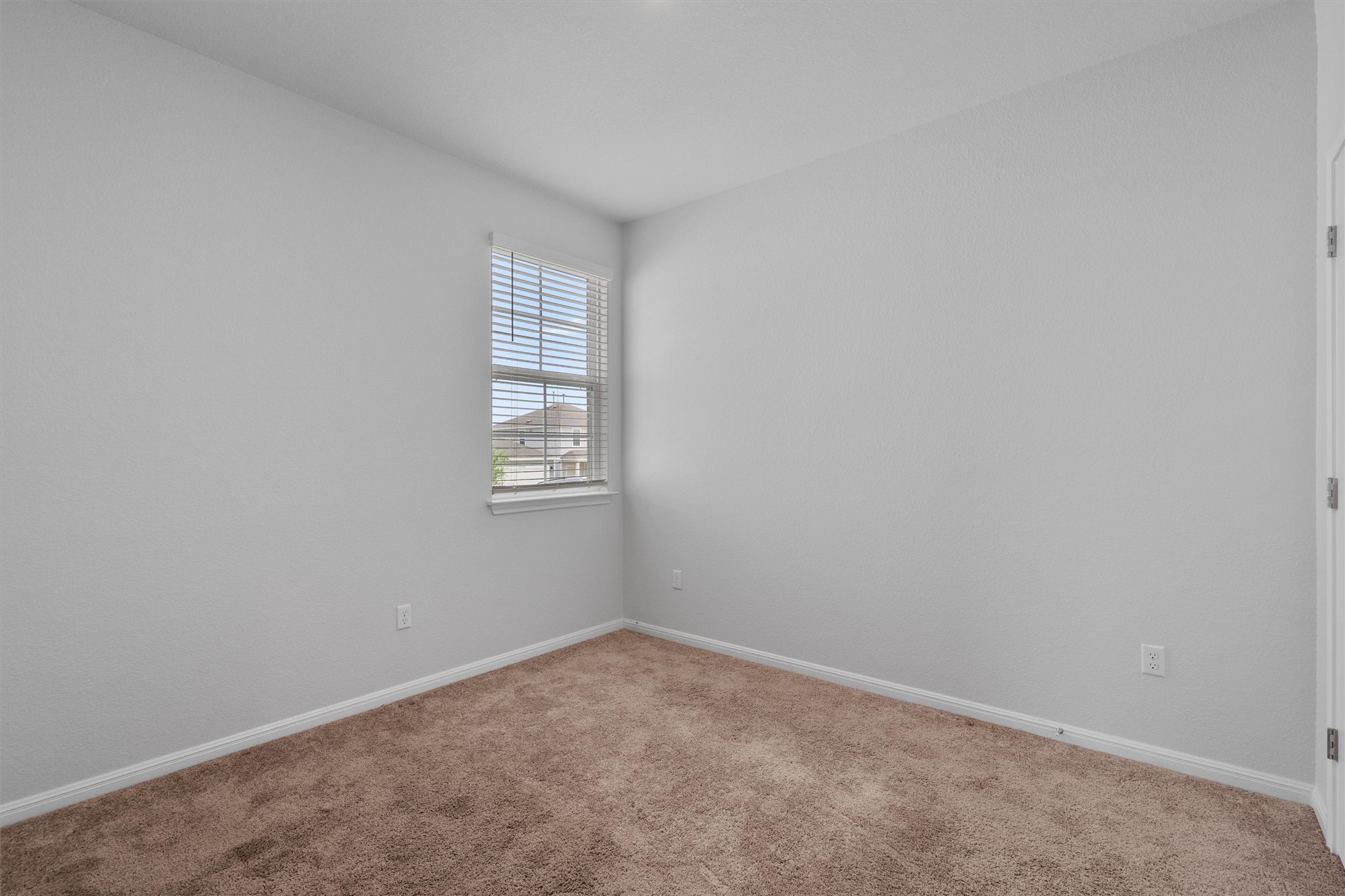 10613 Ridan Way Buda, TX 78610 - Photo 20 of 32 an empty room with windows