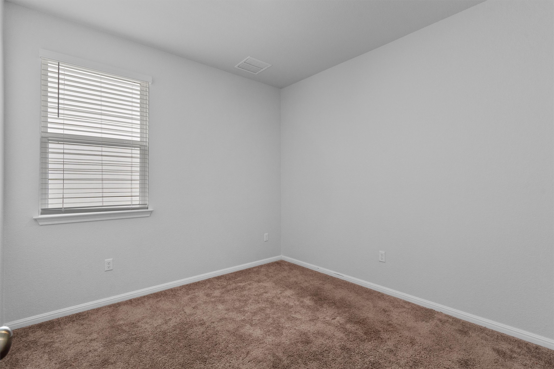 10613 Ridan Way Buda, TX 78610 - Photo 22 of 32 an empty room with a window