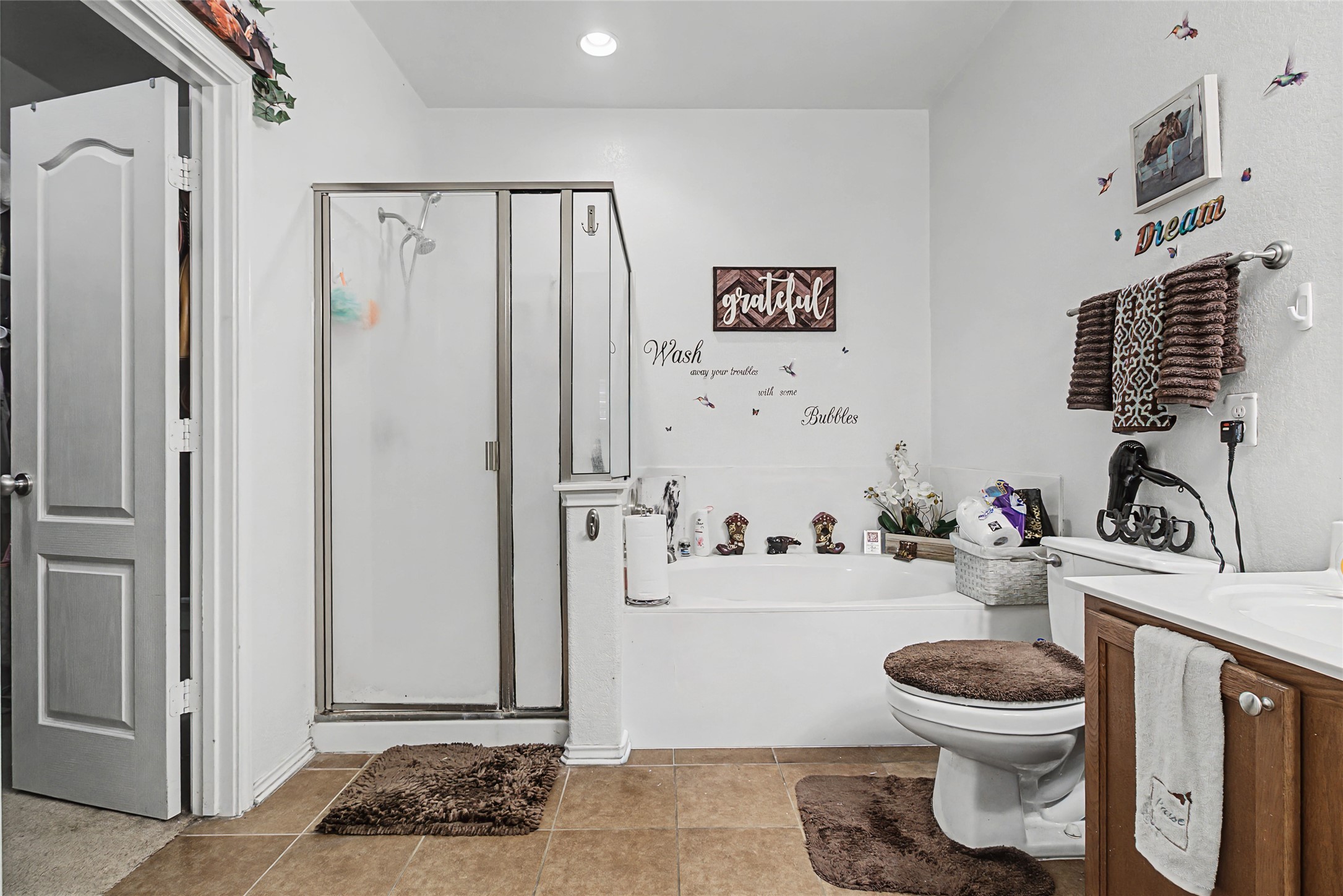 344 Matthews Kyle, TX 78640 - Photo 11 of 15 Full bath with a shower stall, vanity, a bath, recessed lighting, and light tile patterned floors