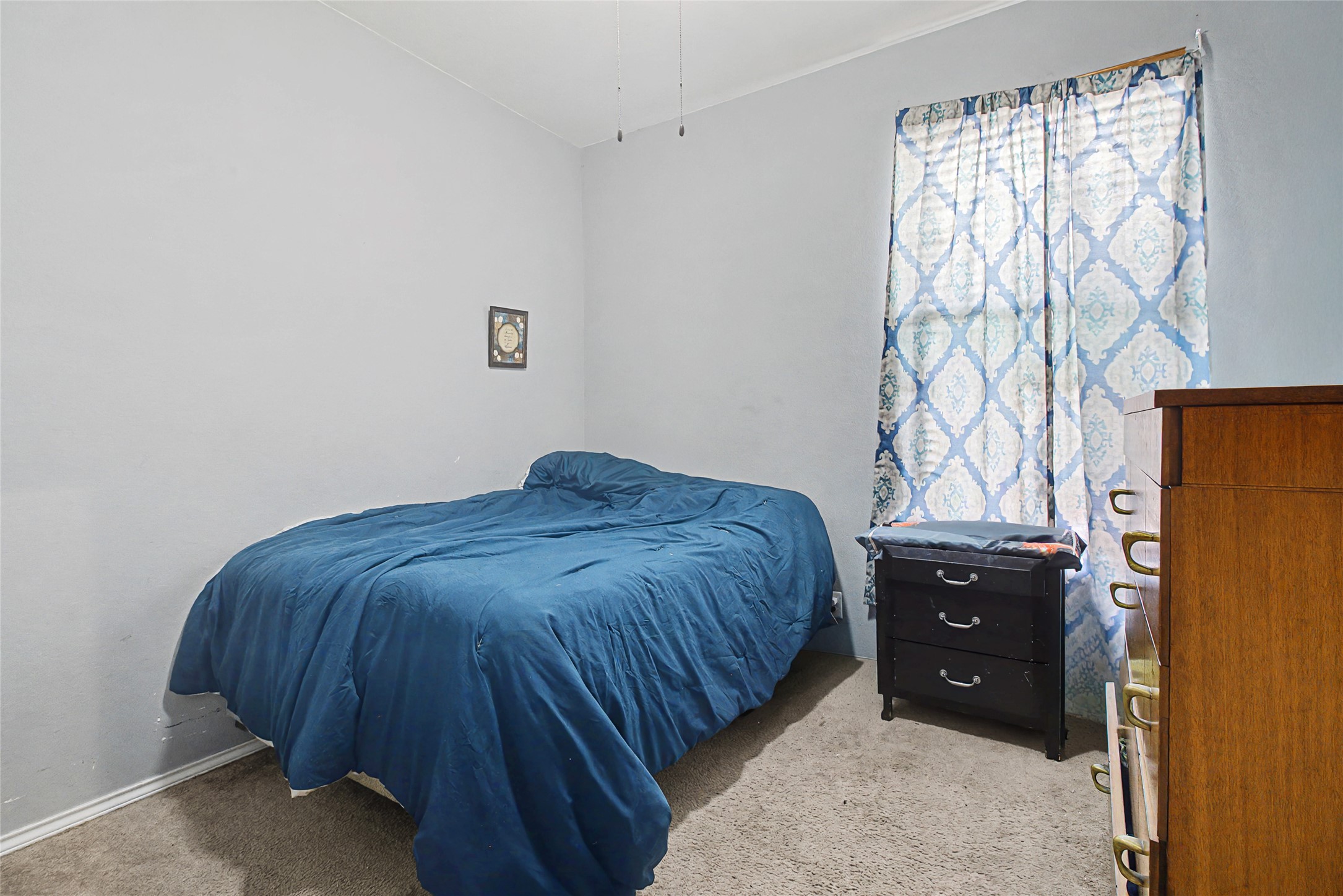344 Matthews Kyle, TX 78640 - Photo 12 of 15 Bedroom with light colored carpet and baseboards