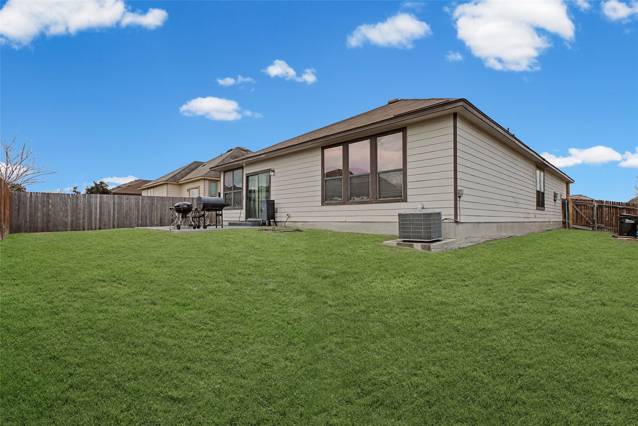 344 Matthews Kyle, TX 78640 - Photo 15 of 15 Back of house with a fenced backyard and a patio area