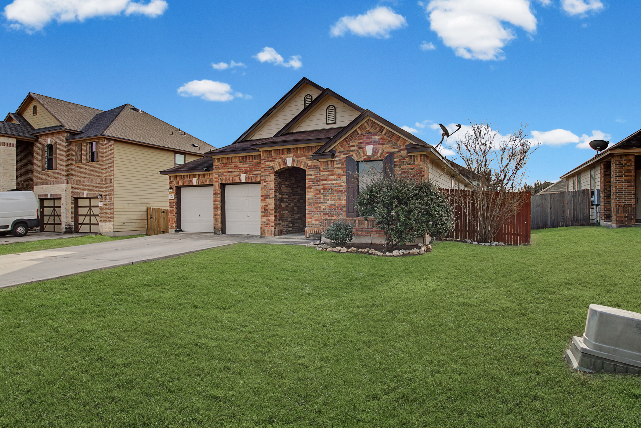 344 Matthews Kyle, TX 78640 - Photo 2 of 15 View of front of house with driveway, brick siding, and a garage