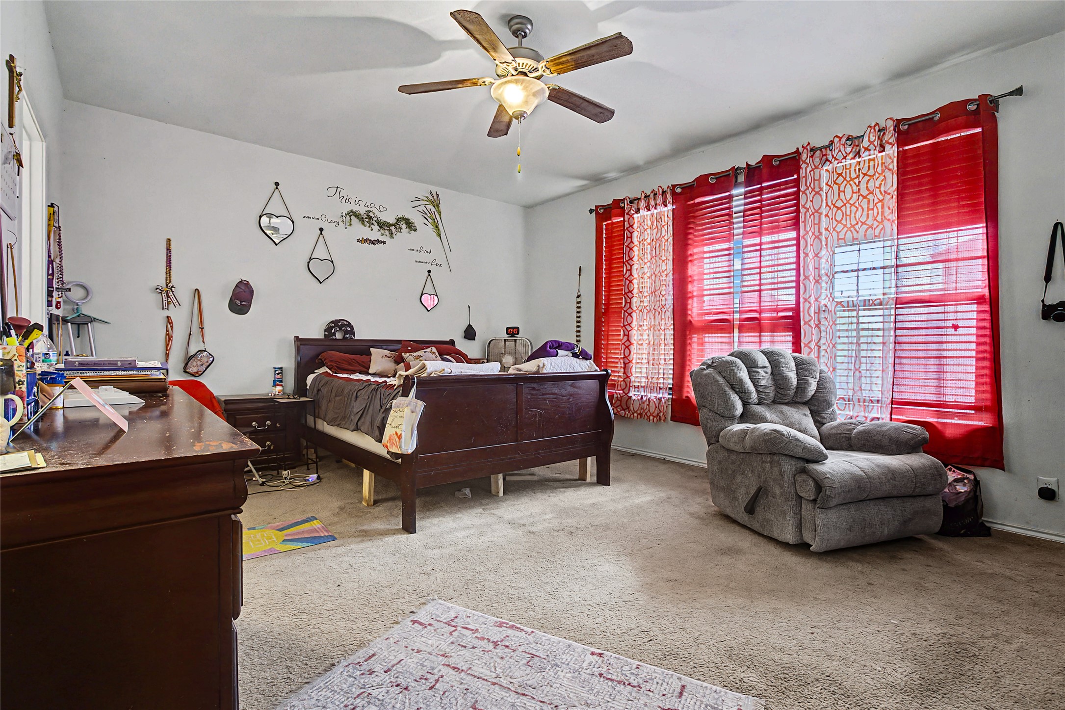 344 Matthews Kyle, TX 78640 - Photo 8 of 15 Bedroom with light colored carpet and ceiling fan