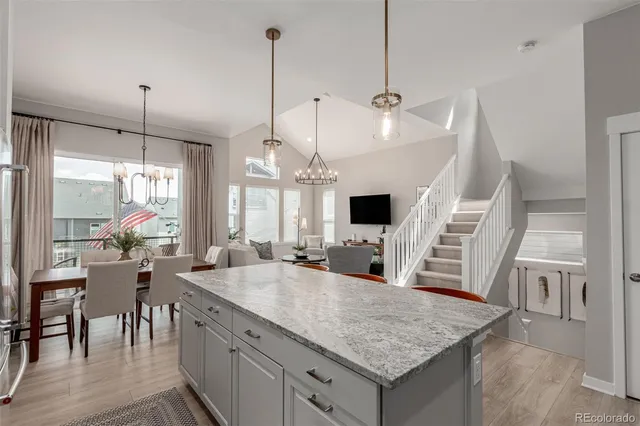 a kitchen with counter space appliances and furniture