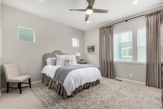 a bedroom with bed and a window