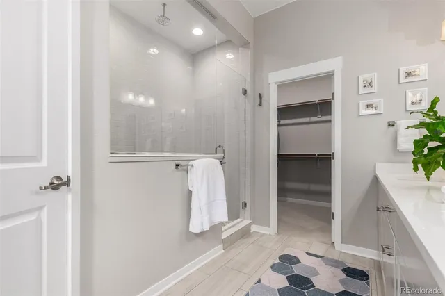 a bathroom with a shower and a sink