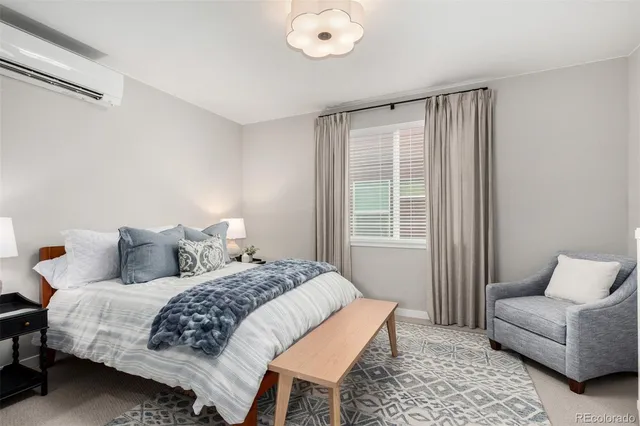 a bedroom with a bed and a couch