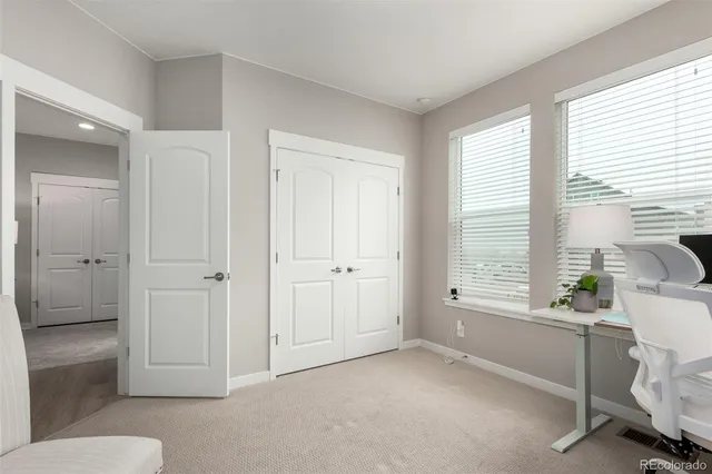 a view of a room with window and cabinet