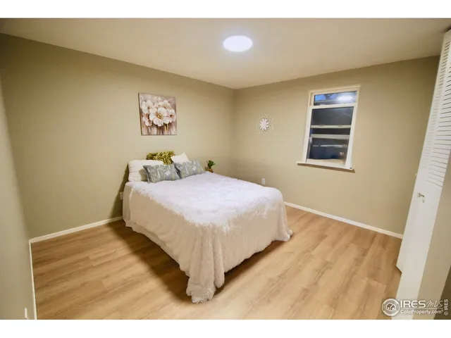 a bathroom with a double vanity sink a toilet and a shower