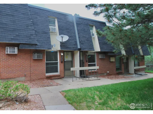 a brick house with a large window