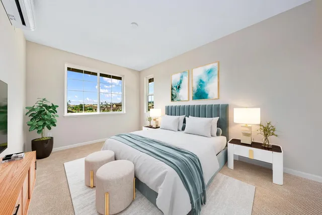 a bedroom with a bed and a couch