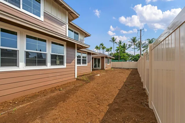 a view of a house with a backyard