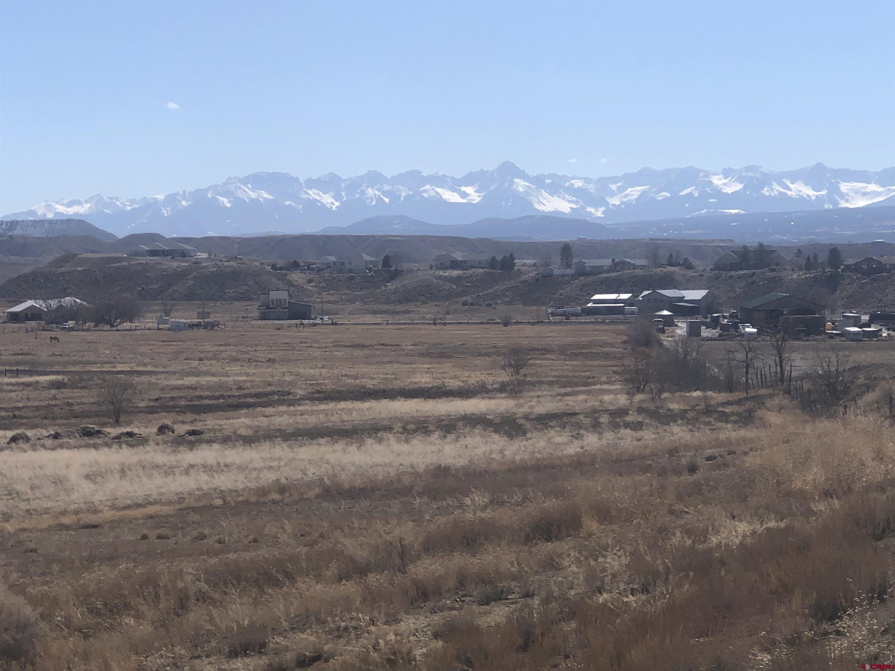 Tract A & 3 East Oak Grove Road Montrose, CO 81401 - Photo 3 of 11 a view of a town with mountains in the background