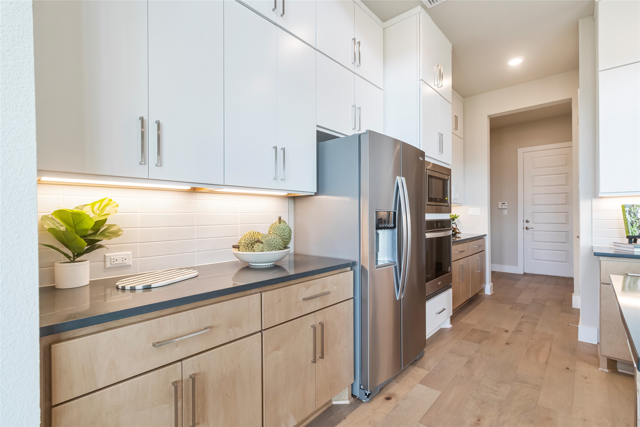 605 Crescent View Drive Georgetown, TX 78628 - Photo 11 of 39 a kitchen with stainless steel appliances white cabinets and a refrigerator