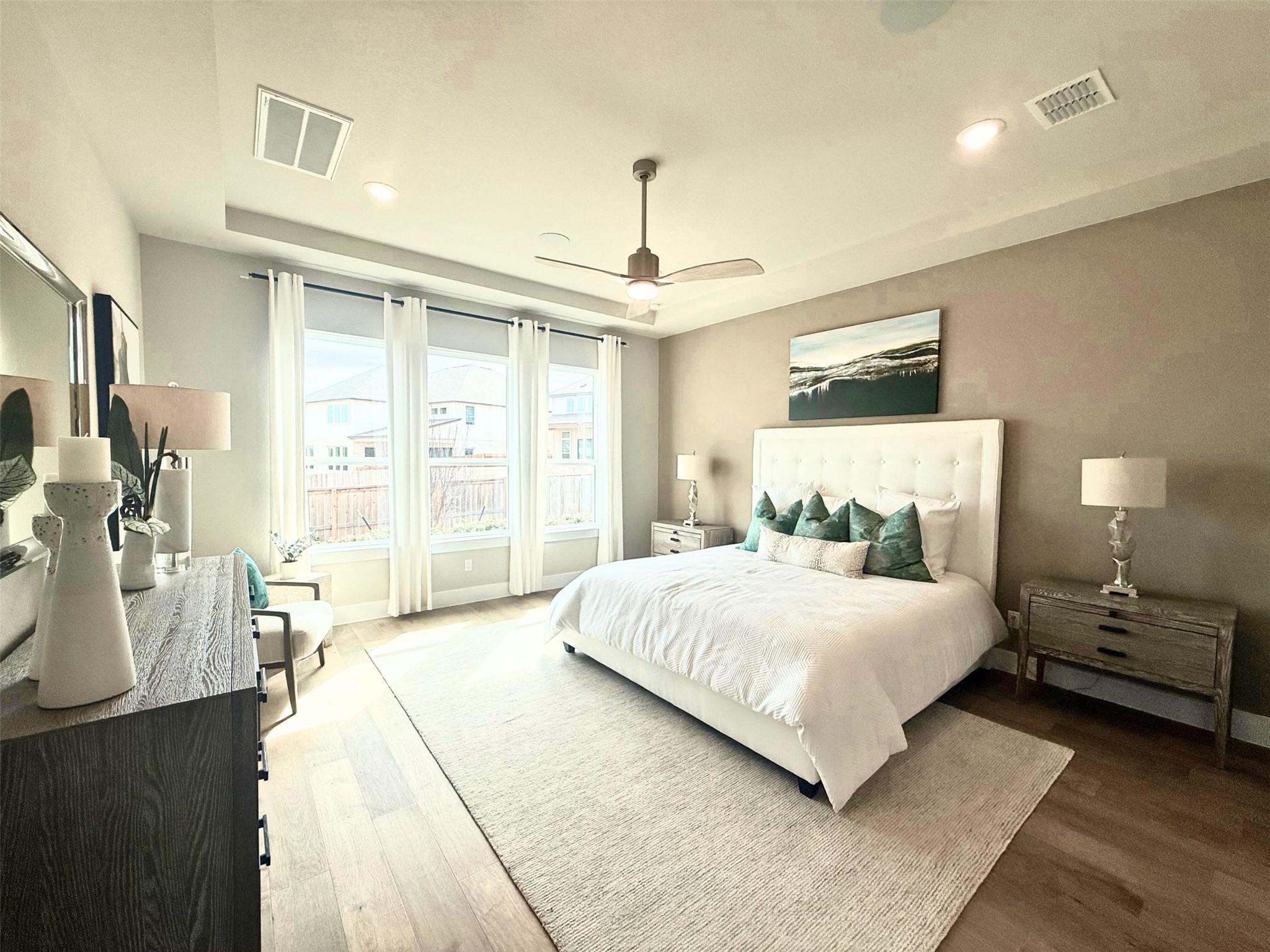 605 Crescent View Drive Georgetown, TX 78628 - Photo 13 of 39 a bedroom with a large bed and a chandelier