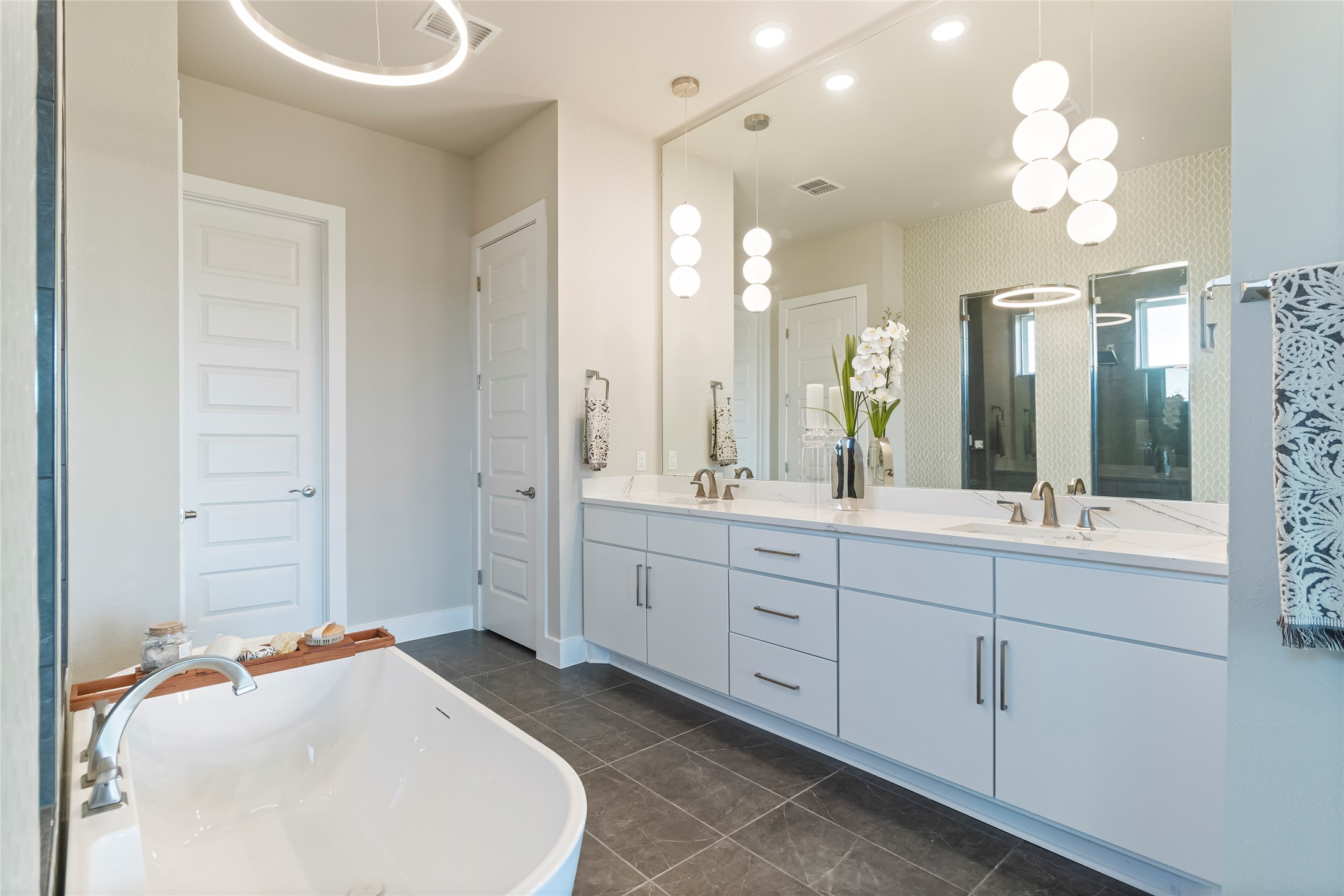605 Crescent View Drive Georgetown, TX 78628 - Photo 15 of 39 a spacious bathroom with a sink double vanity and a mirror