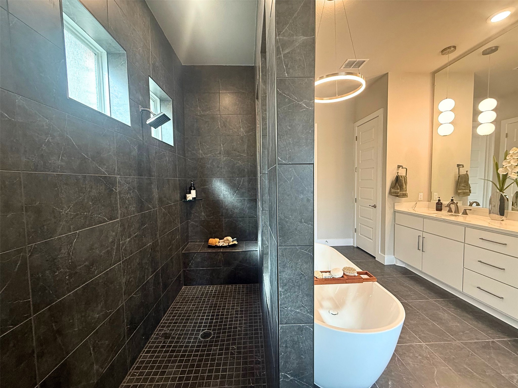 605 Crescent View Drive Georgetown, TX 78628 - Photo 16 of 39 a bathroom with a granite countertop sink a toilet a mirror and shower