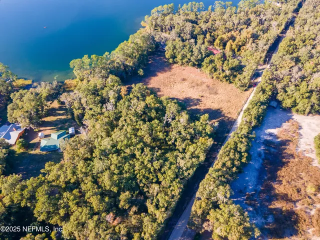 an aerial view of a houses with outdoor space