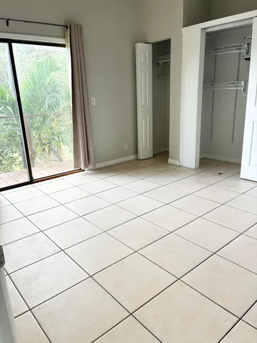 a view of empty room with cabinet