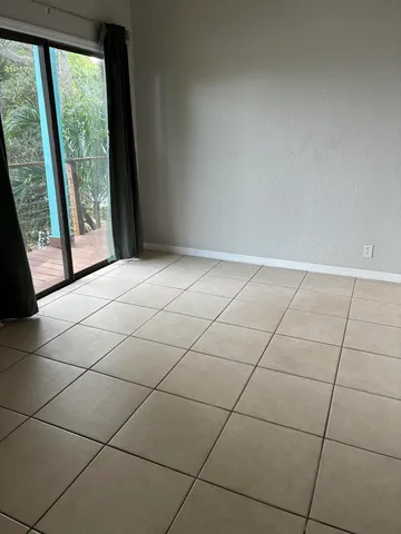 a view of an empty room and window