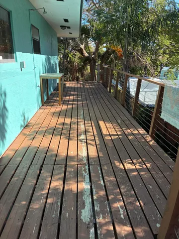 a view of balcony with wooden floor