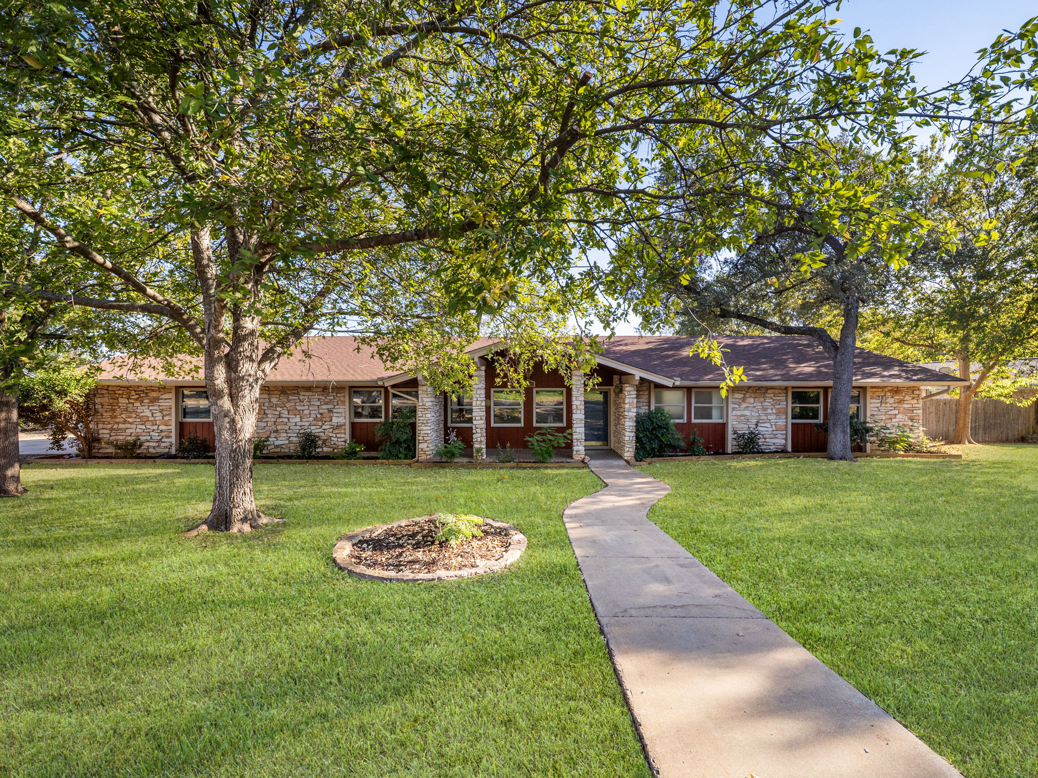 Welcome to 806 Country Club Road! Sitting on a half acre lot perched over a greenbelt and the San Gabriel River