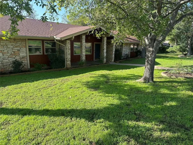a view of a house with a garden