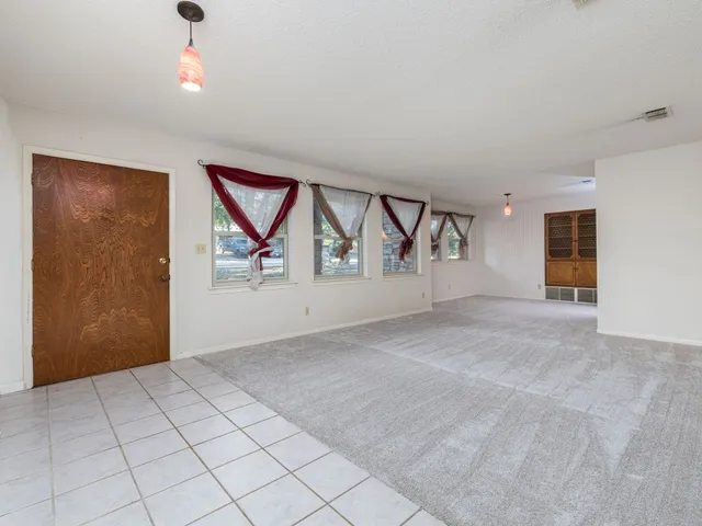 a view of an empty room and window