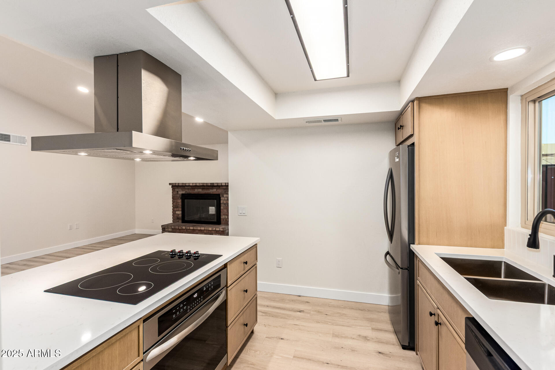 1514 West Loughlin Drive Chandler, AZ 85224 - Photo 14 of 33 a kitchen with stainless steel appliances granite countertop a stove a sink and a refrigerator