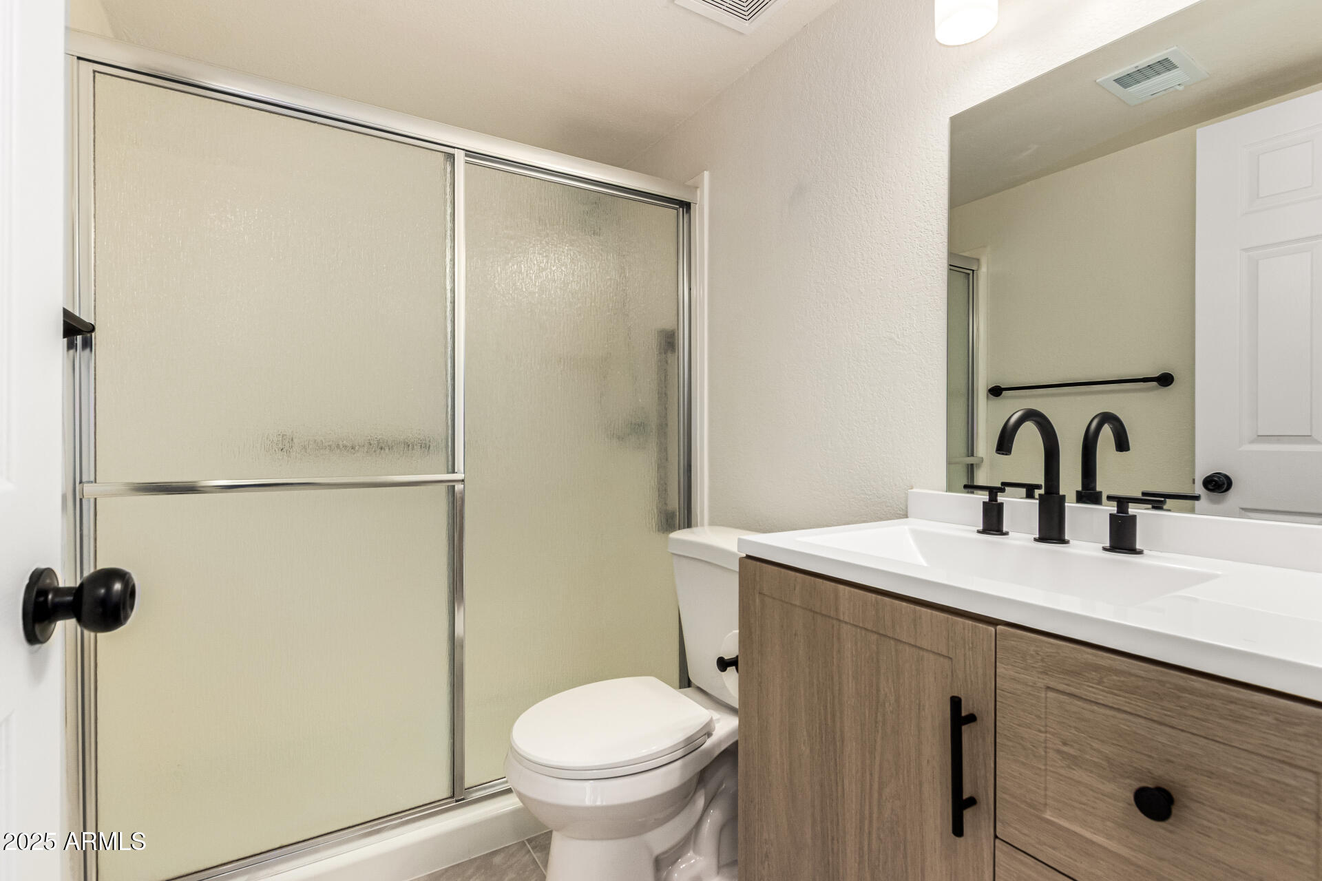 1514 West Loughlin Drive Chandler, AZ 85224 - Photo 19 of 33 a bathroom with a sink toilet and shower