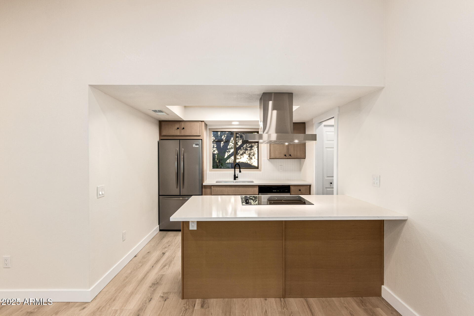 1514 West Loughlin Drive Chandler, AZ 85224 - Photo 2 of 33 a room with kitchen island a sink a stove and a refrigerator with wooden floor