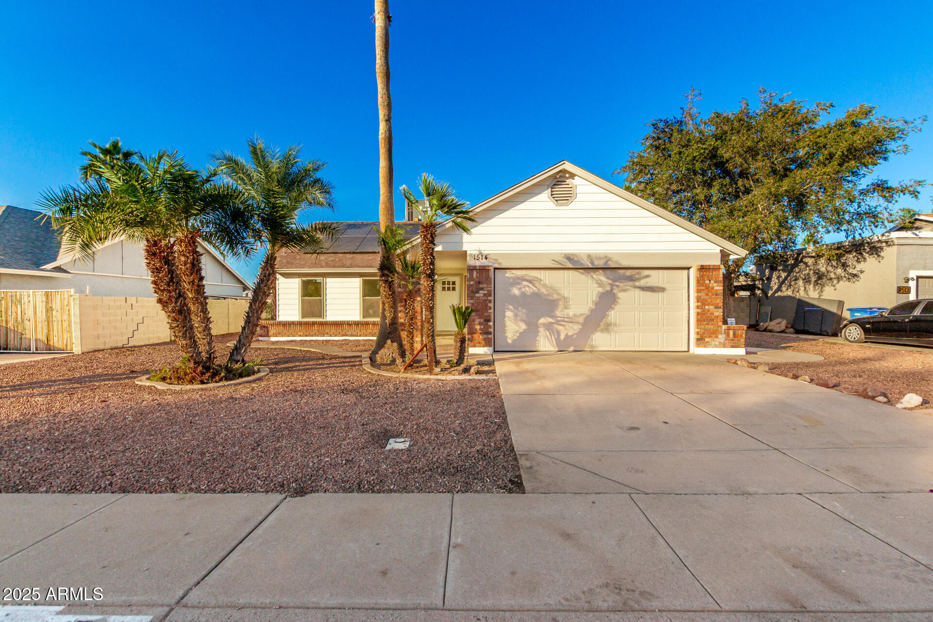 1514 West Loughlin Drive Chandler, AZ 85224 - Photo 3 of 33 a view of a house with a yard and potted plants