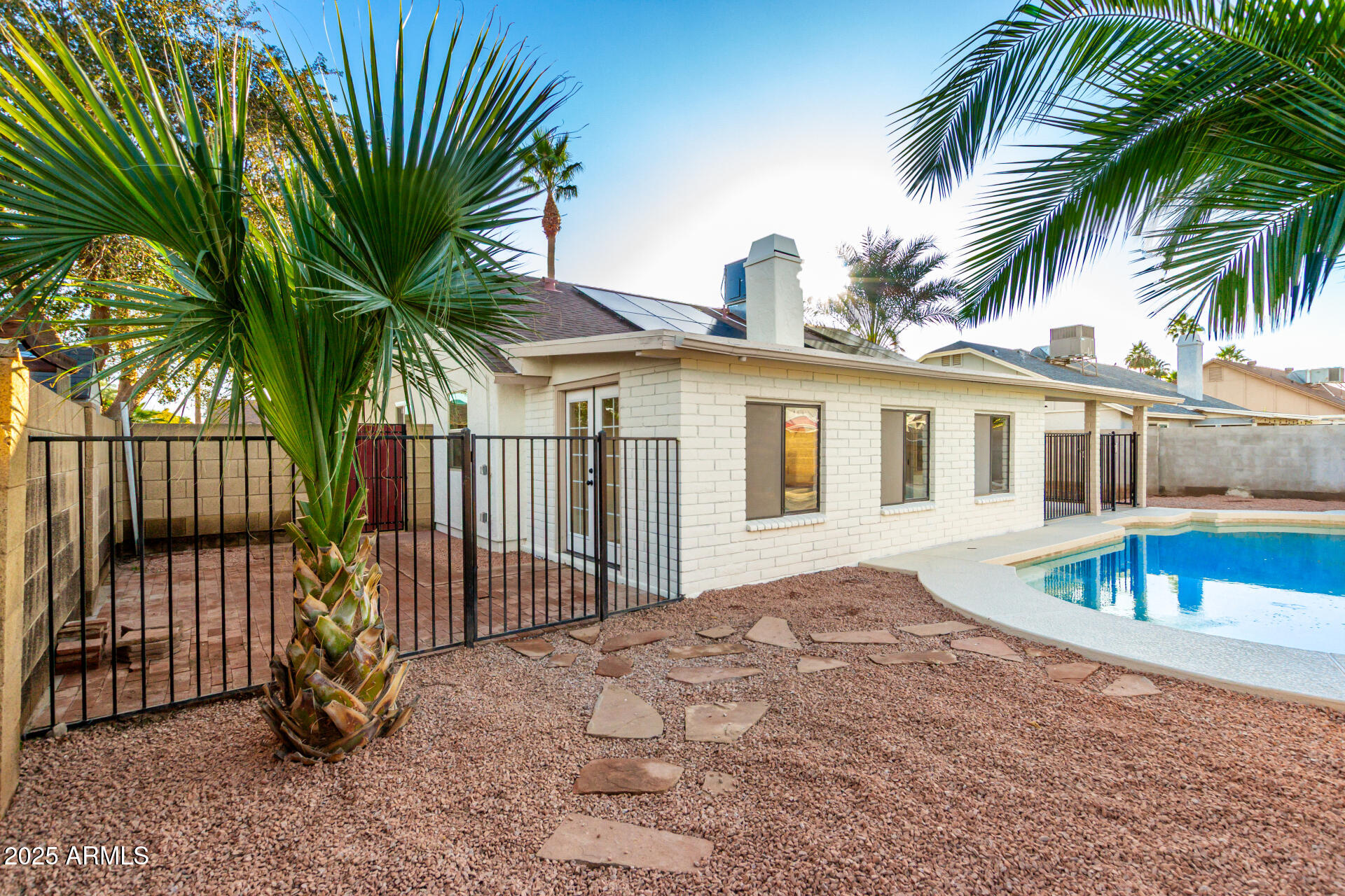 1514 West Loughlin Drive Chandler, AZ 85224 - Photo 31 of 33 a view of a house with backyard and swimming pool
