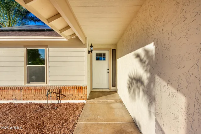 a view of a house with a door and wooden floor