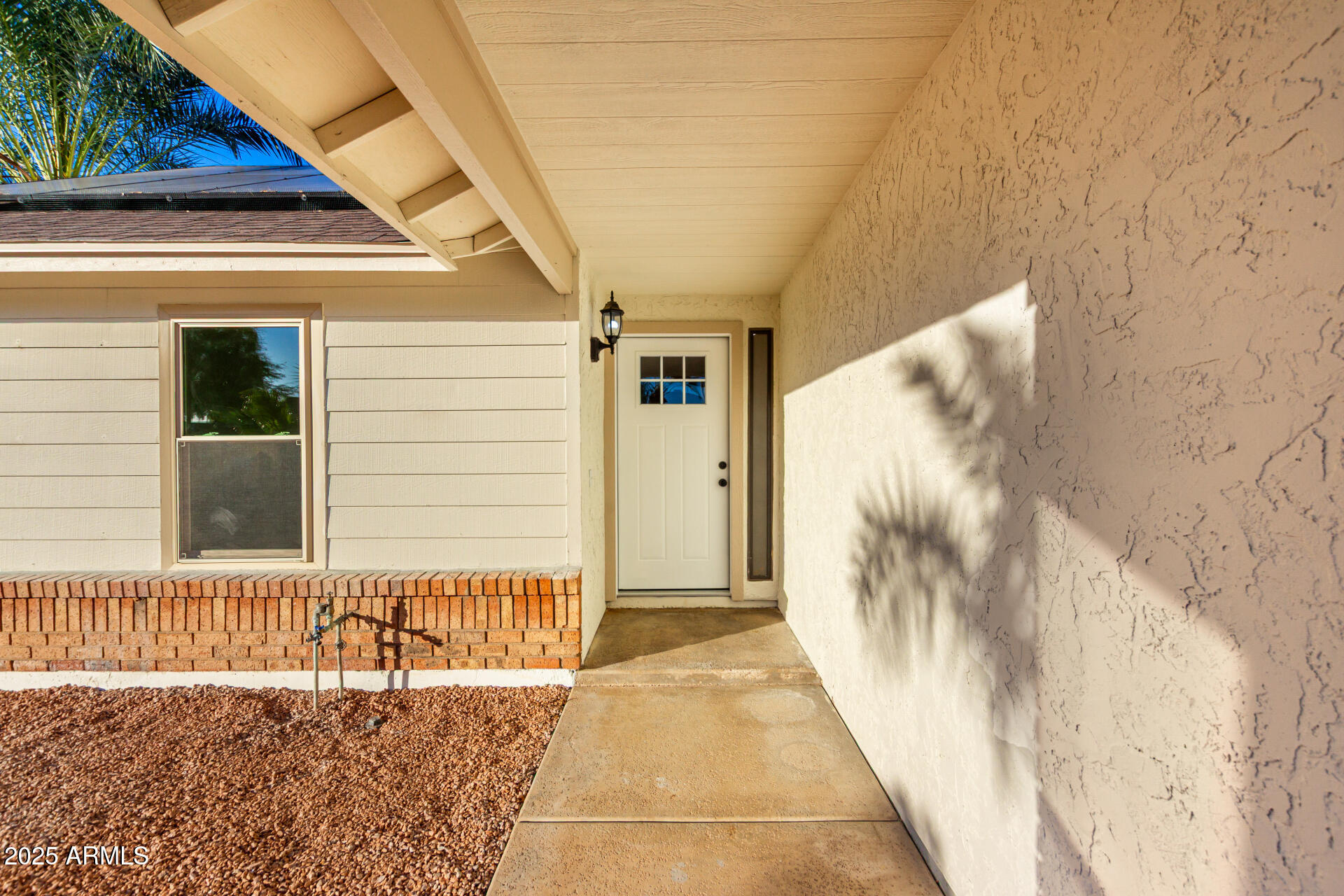 1514 West Loughlin Drive Chandler, AZ 85224 - Photo 9 of 33 a view of a house with a door and wooden floor
