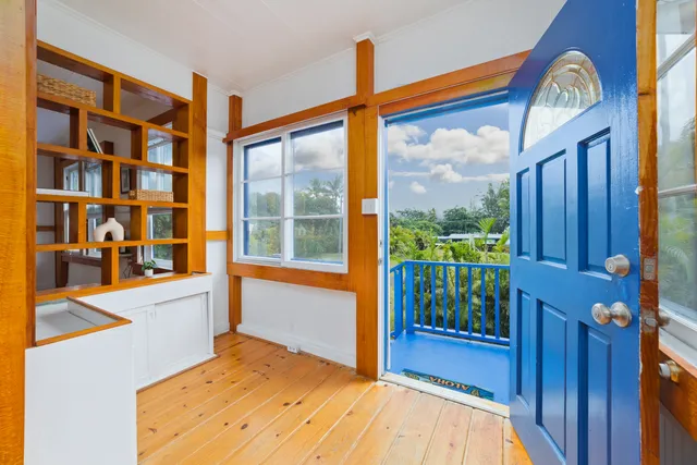 a view of a living room and balcony