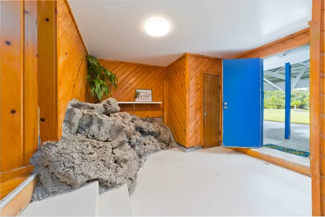 a bedroom with a large bed and a large window