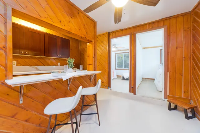 a view of an house with swimming pool outdoor seating area and garden